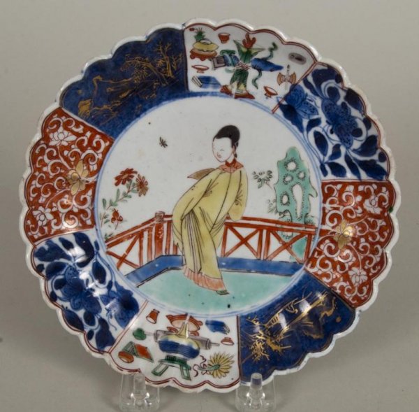 Antique Chinese Export porcelain Imari dish: Antique Chinese Export porcelain Imari dish, Qing Dynasty, probably Kangxi Period, with scalloped rim centering a lady in pavilion garden, 7"dia. Provenance: Philip Suval, Inc., NY
