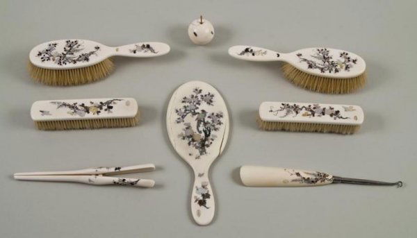 Antique Japanese (8)-piece Shibayama dressing set: Antique Japanese (8)-piece Shibayama dressing set, Meiji Period, comprising: (2) handled brushes; (2) straight brushes; (1) hand mirror; (1) paperweight; (1) shoe horn/button hook; and (1) glove stret