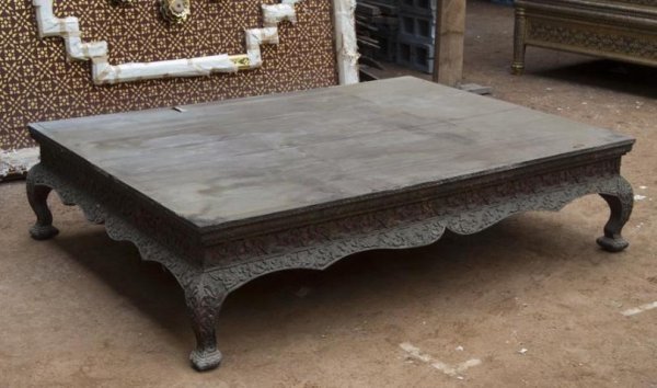 Antique Thai carved giltwood and painted reclining: Antique Thai carved giltwood and painted reclining platform, 19th century, of Chinese influenced design carved with scrolling foliage on all sides with shaped apron on cabriole legs and scaled feet, 1