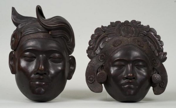 Pair Southeast Asian carved wood face masks: Pair Southeast Asian carved wood face masks, 20th century, male and female images, larger: 13"h x 9"w Provenance: Doris Duke's Southeast Asian Collection