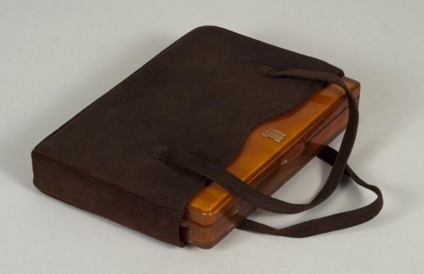 Doris Duke's gold inlaid Bakelite vanity case: Doris Duke's gold inlaid Bakelite vanity case, First half 20th century, attributed to Morabito, Paris, monogrammed "DDC", in suede slipcase, 7"l x 4"w x 1"d Provenance: The Estate of Doris Duke to ben