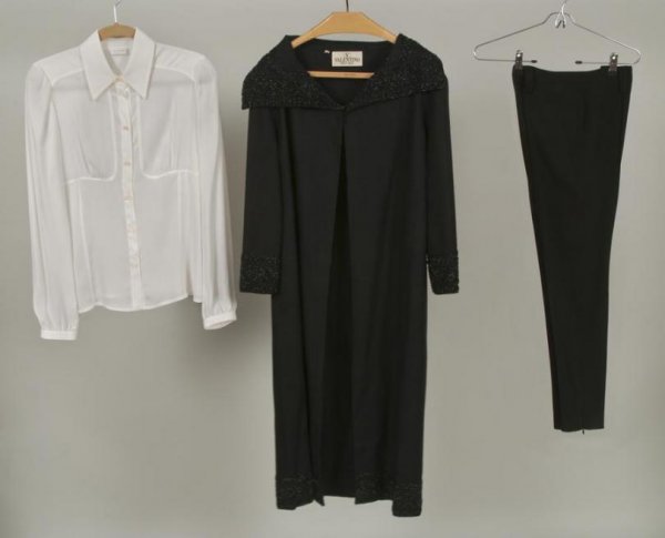 Group Valentino clothing: Group Valentino clothing, Including: (1) Valentino Boutique black wool coat with black beading; (1) cream silk shirt; and (1) pair black silk pants, coat: 18"sh x 20"sl x 42"b x 47"l, blouse: 15"sh x 