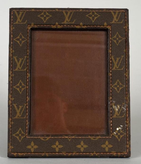 Louis Vuitton table-top picture frame: Louis Vuitton table-top picture frame, 20th century, with monogram print, 9.75" x 8"(frame size), 6.75" x 5"(sight size)