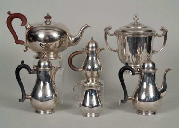Group (6) English sterling silver teawares: Group (6) English sterling silver teawares, 19/20th century, London, including: (1) large teapot; (3) solitaire teapots; (1) sugar urn; and (1) cream jug, makers include Crichton Bros., Mappin & Webb