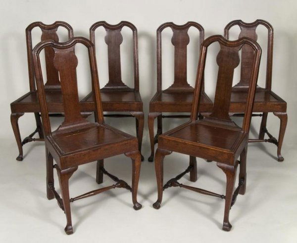 Set (6) Queen Anne carved oak dining chairs: Set (6) Queen Anne carved oak dining chairs, 18/19th century, each with yoke-form crest rail and panel seat on cabriole legs, later slip cushions, 38.5"h x 18"w x 16"d