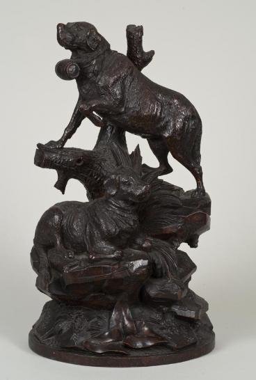 Large Black Forest carved wood dog group: Large Black Forest carved wood dog group, 19th century, depicting two St. Bernards amongst rockwork and branches, 19.25"h x 11"w x 6.75"d