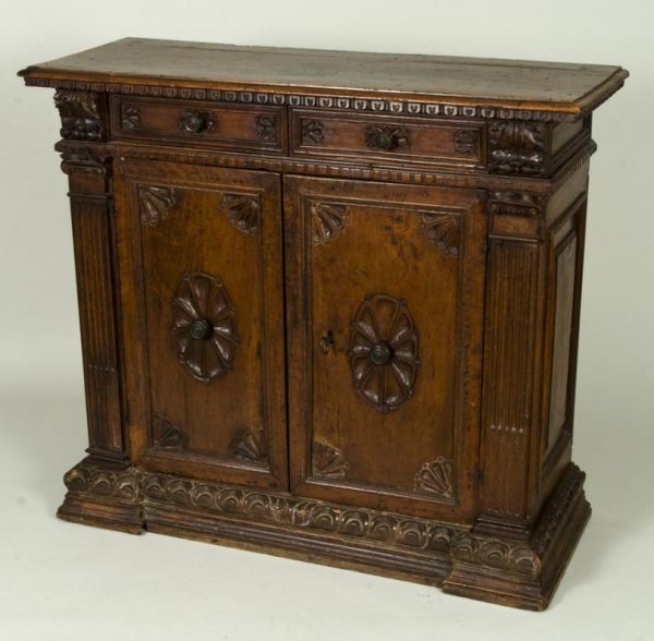 Antique Italian Renaissance style carved walnut cr: Antique Italian Renaissance style carved walnut credenza, Probably 16/17th Century and later, the rectangular molded top over 2 drawers and 2 cupboard doors on molded base, 39"h x 44.5"l x 16"d