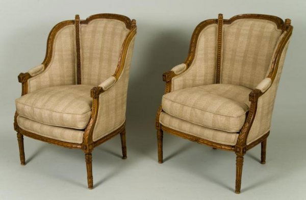 Pair antique Louis XVI style carved beechwood berg: Pair antique Louis XVI style carved beechwood bergeres, 19/20th Century, each laurel and bead carved frame with loose cushion seat on round tapering stop-fluted legs, 36.5"h x 27"w x 22.5"d