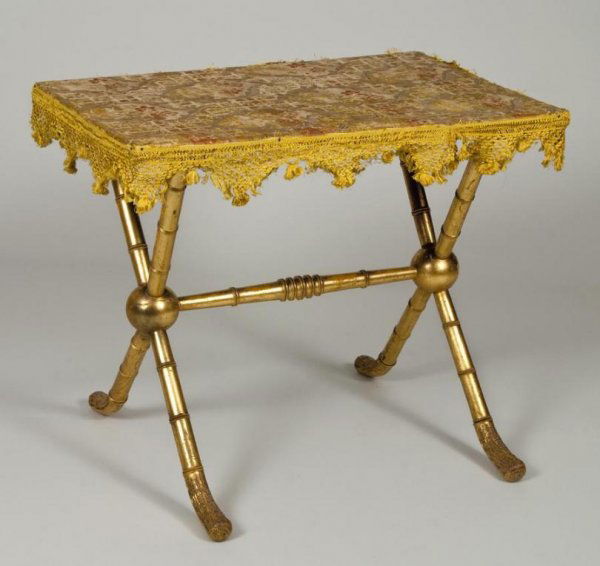 Napoleon III bamboo-turned giltwood side table: Napoleon III bamboo-turned giltwood side table, 19th century, the rectangular top with antique brocade upholstery and silk apron on an X-form base ending in root-form feet, 27.5"h x 31.5"l x 21.5"d