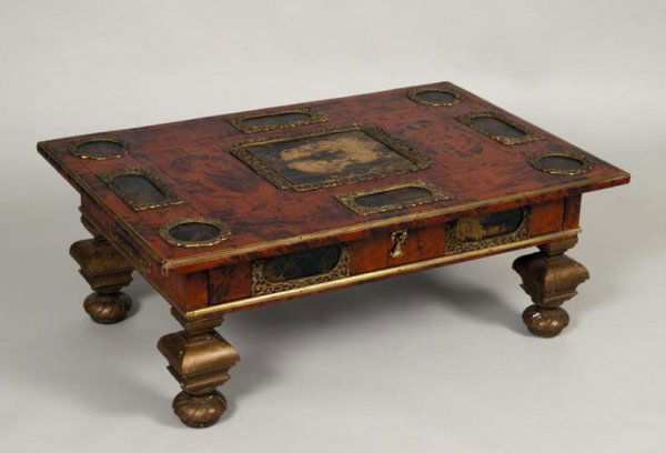 Regence style faux tortoiseshell leather and japan: Regence style faux tortoiseshell leather and japanned low table, 19/20th century, the rectangular top set with 9 bronze-framed black japanned panels over a similarly mounted frieze with drawer raised
