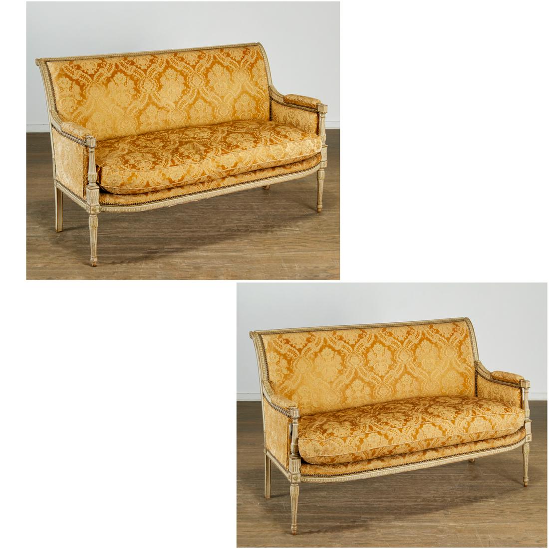 Pair Louis XVI style carved and painted sofas: Pair Louis XVI style carved and painted sofas, mid 20th c., gray and green painted carved wood frame settees, with acanthus carved arms, and fluted legs ending on arrow feet, in champagne carved flora
