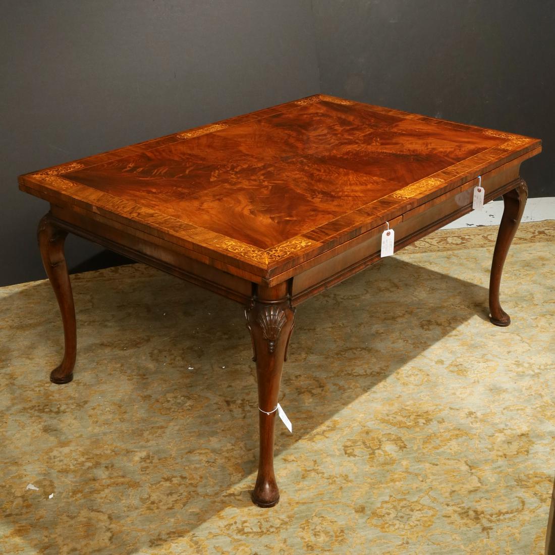 George II style seaweed marquetry dining table: George II style seaweed marquetry dining table, First half 20th c., inlaid top with draw-leaves, on shell-carved cabriole legs ending in pad feet, 30"h (24"h to bottom of skirt) x 41.75"w x 61.5"l (wi