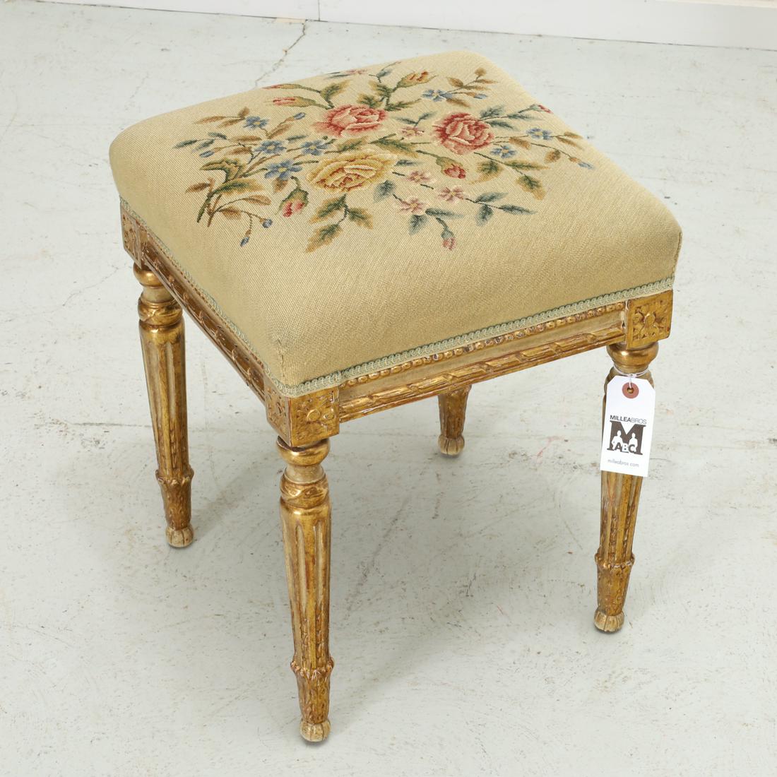 Louis XVI style painted and giltwood tabouret: Louis XVI style painted and giltwood tabouret, 19th/20th c., France, the upholstered seat embroidered with rose branches, on carved frame decorated with rosettes and beading, raised on round tapering 