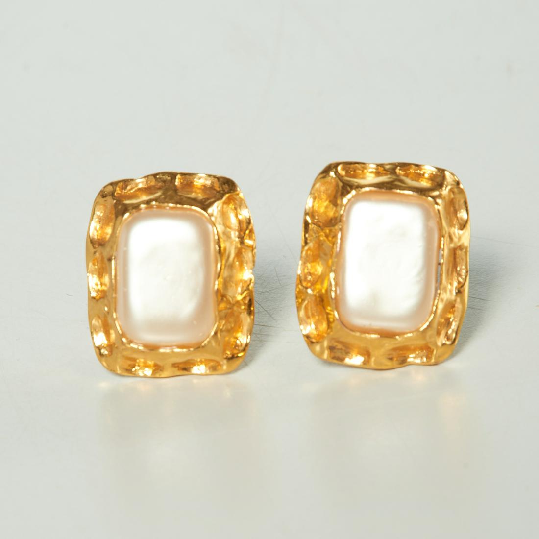 Authentic Chanel faux pearl clip on earrings: Authentic Chanel faux pearl clip on earrings, 20th c., featuring gold-tone hardware with faux pearl center, stamped "Chanel Made in France", approx. 1" x 1.25"