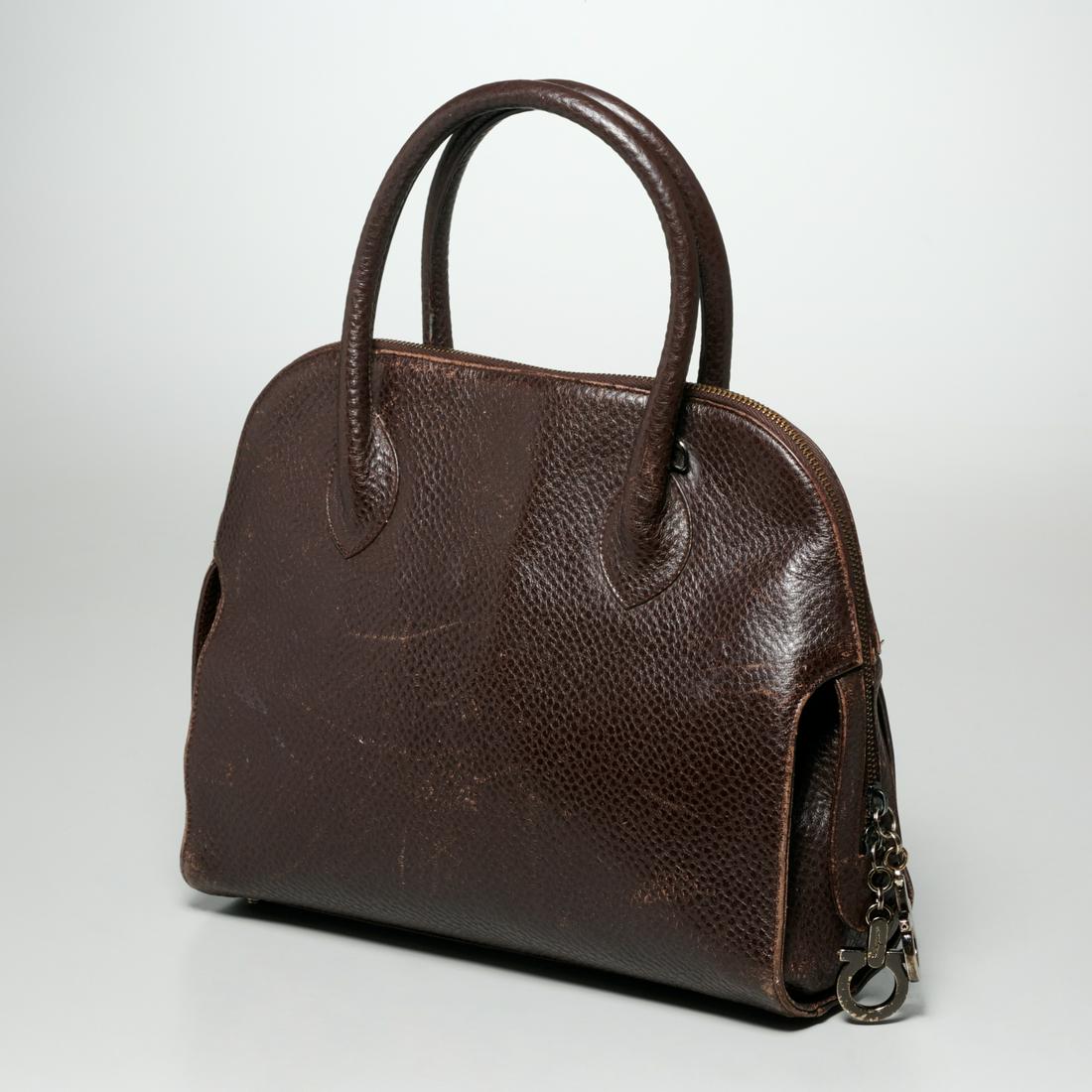 Salvatore Ferragamo brown top handle bag: Salvatore Ferragamo brown top handle bag, 20th c., Made in Italy, top zipper and dangling logo pulls, pebbled leather, logo fabric interior with center divider, zipper pocket and key clip, #DX-217 631