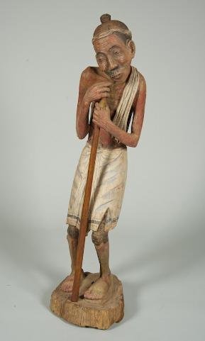 Southeast Asian carved and polychromed wood figure: Southeast Asian carved and polychromed wood figure, 20th century, emaciated pilgrim, 56"h x 16"w Provenance: Fawn Hill Farm, Morristown, NJ
