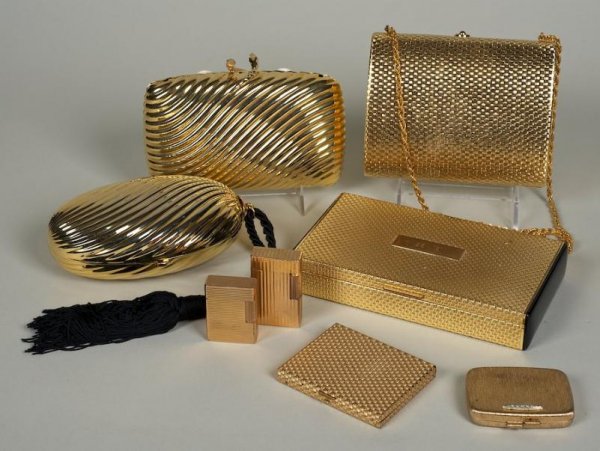 Group Cartier style lady's gold plated accessorie: Group Cartier style lady's gold plated accessories, 20th century, incl. Dupont lighters and Judith Lieber style purses, largest box: 7"l