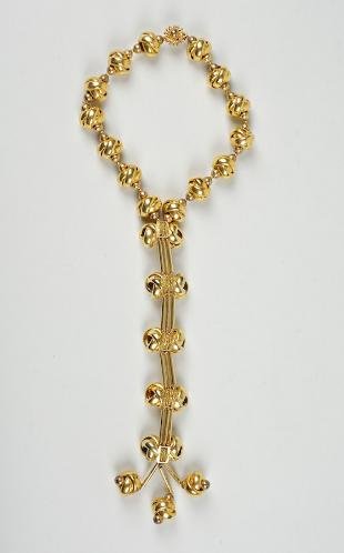 William De Lillo gold toned metal knotted necklac: William De Lillo gold toned metal knotted necklace, 20th century, 17"l