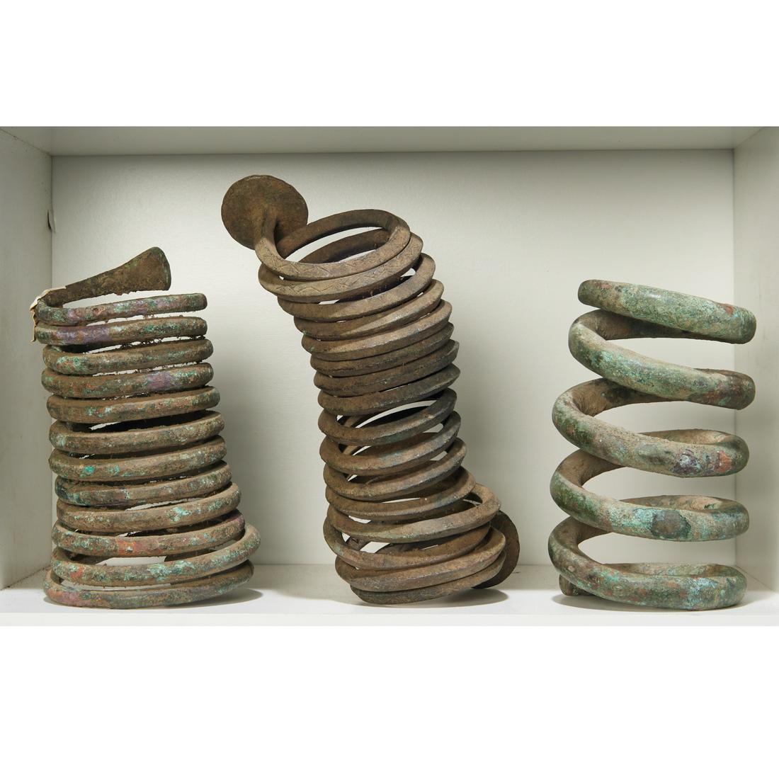 African Peoples, (3) coil currencies, exhibited (1 of 4)