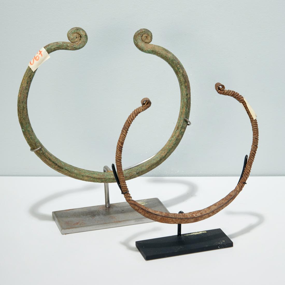 (2) West African torque currencies, exhibited (1 of 3)