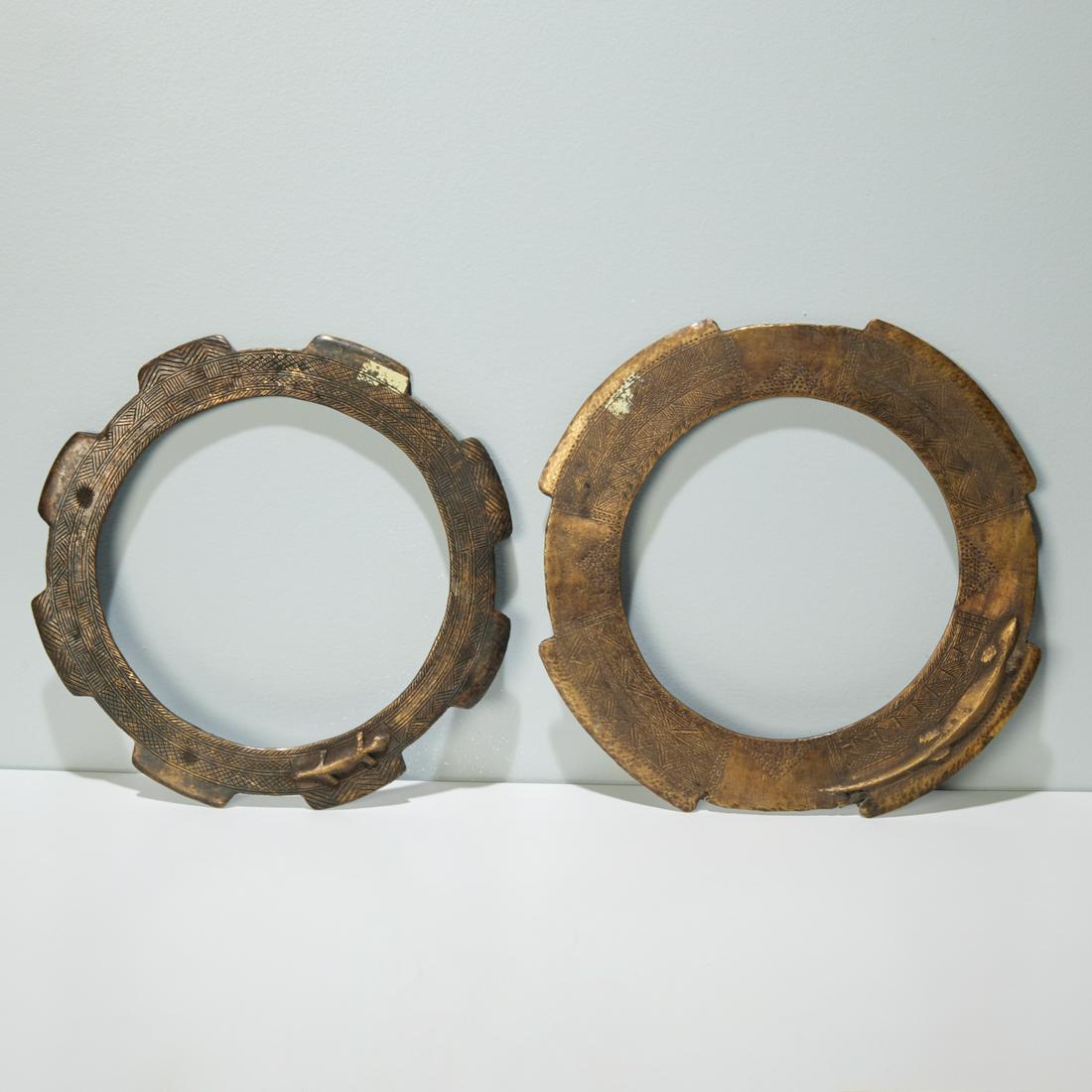 Take Peoples, (2) bronze collars, Onlua: Take Peoples, (2) bronze collars, Onlua, D.R. Congo, Reserved for important individuals, each forged bronze disk decorated with raised lizards and incised geometric decoration, which indicated status,