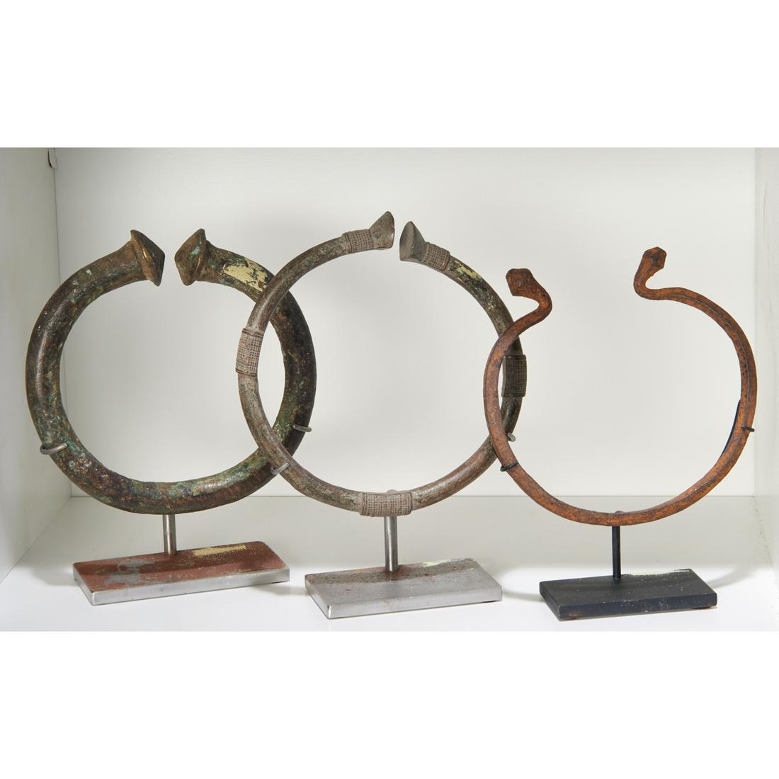 (3) West African torque currencies, exhibited (1 of 4)