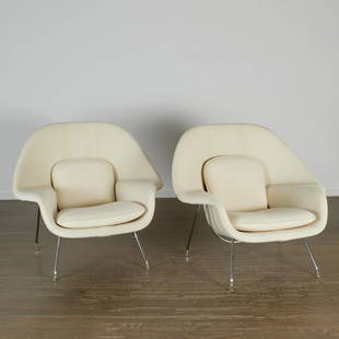 Eero Saarinen for Knoll, pair "Womb" chairs: Eero Saarinen for Knoll, pair "Womb" chairs, 21st c., cream boucle upholstery with loose back and seat cushions, on steel frame, paper label to underside, approx. 35"h x 41"w x 33"d Provenance: A