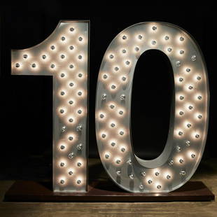 Colossal 'Number 10' marquee sculpture: Colossal 'Number 10' marquee sculpture, 20th c., silver enameled sheet metal, mirrored bulbs, mounted on brown enameled metal plinth, unmarked, 74"h x 88"l x 20"w Provenance: A Private Collection: