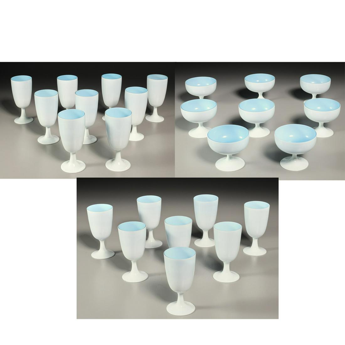 Carlo Moretti, (25) piece cased stemware: Carlo Moretti, (25) piece cased stemware, c. 1960s, Italy, white exterior and turquoise blue interior fused glass, including (9) water goblets, 7"h, (8) wine glasses, 5"h, and (8) sherbet bowls, 4"h P