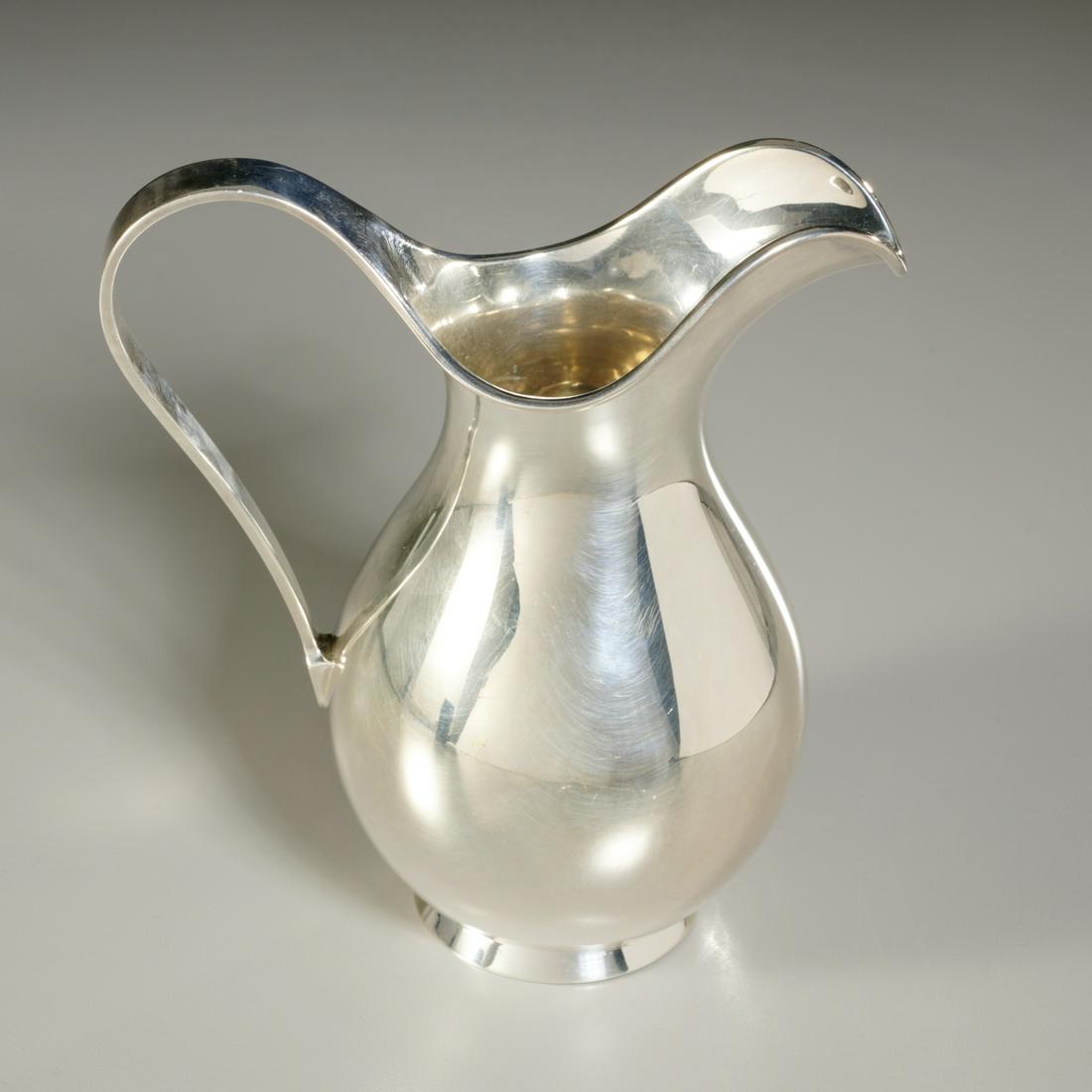Kay Fisker for A. Michelsen, modern silver pitcher: Kay Fisker for A. Michelsen, modern silver pitcher, Dated 1959, Denmark, sterling silver, stamped to underside with designer, maker, assayer, size and letter date, 7"h x 6"l x 4"w, approx. 14.9ozt Pro