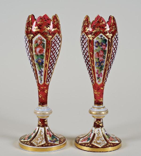 Fine pair Bohemian cased and enameled glass vases: Fine pair Bohemian cased and enameled glass vases, 19th c., white cut to ruby, nicely cut, gilded and painted, 9.25"h x 3.25"dia.