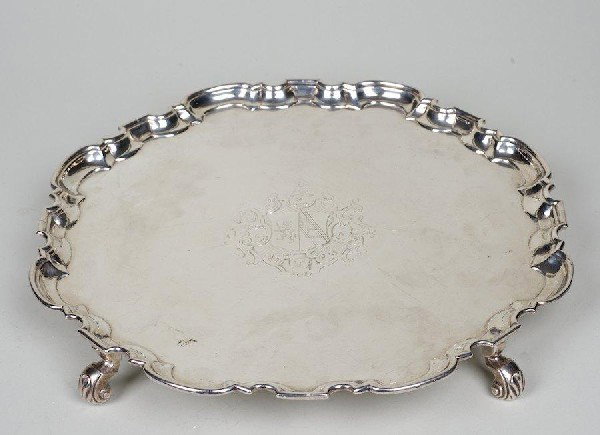 George II sterling silver footed salver: George II sterling silver footed salver, London, c. 1729, maker's mark "WD", probably William Darker, engraved arms, 12.75"dia., approx. 33.7 ozt.