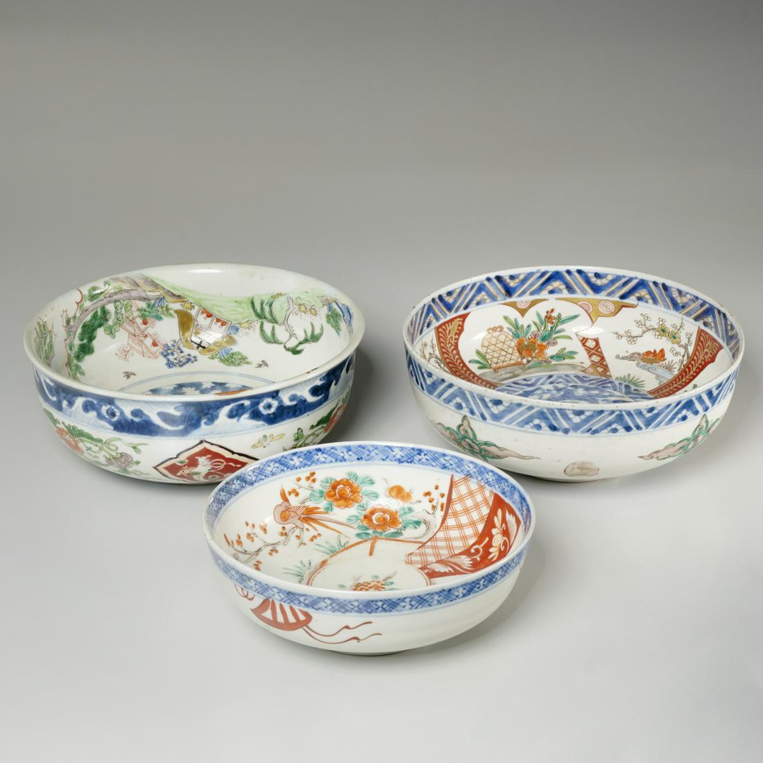 (3) Antique Imari porcelain bowls: (3) Antique Imari porcelain bowls, 19th/20th c., polychrome decorated, incl. dragon, figural, and bird on branch decoration, single blue underglaze ring to underside, 4.25"h x 9.75"dia. (largest), 3'h