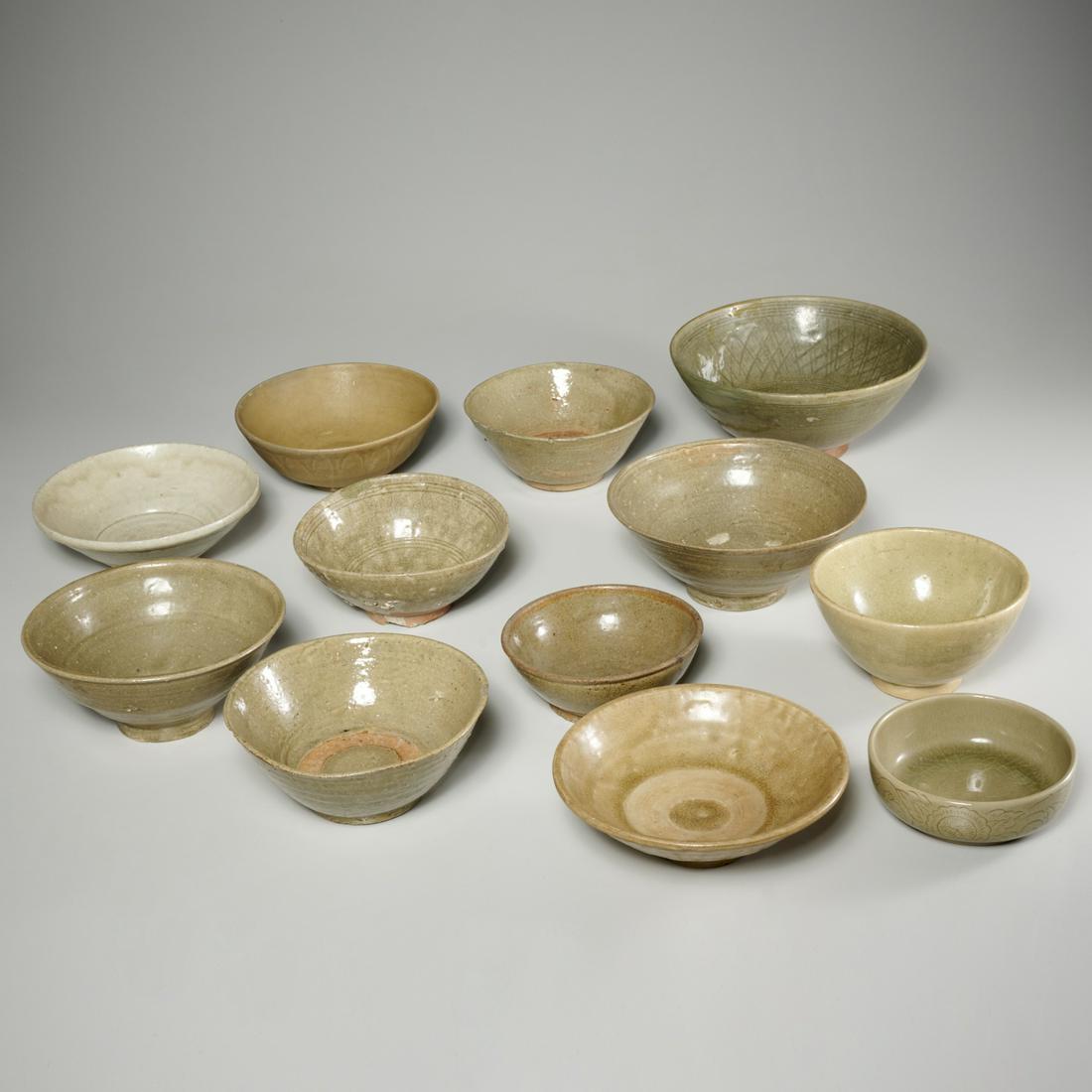 Group (12) antique Asian celadon glazed bowls: Group (12) antique Asian celadon glazed bowls, Possibly Ming Era, likely Thai, Vietnamese, and South Chinese, some decorated with incised designs, 3.5"h x 8"dia (largest), 1.5"h x 4.5"dia (smallest) P