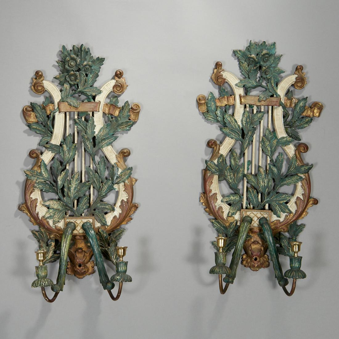 Pair Italian gilt and polychromed wood sconces: Pair Italian gilt and polychromed wood sconces, 19th/20th c., each lyre back carved with leafy branches issuing two candle arms, unmarked, 26.5"h x 12"w x 5.25"d Provenance: From a Private White Plain