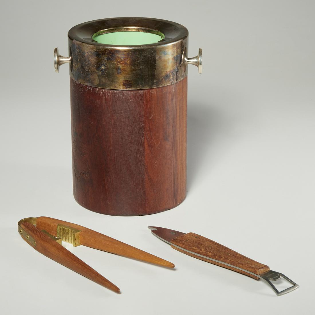 Group (3) Carl Aubock style teak bar items: Group (3) Carl Aubock style teak bar items, Mid-20th c., including a silver-plate mounted wine cooler, unmarked, 9"h x 6"dia, a teak and bronze nut cracker, unmarked, 10"l, and a stainless steel and t