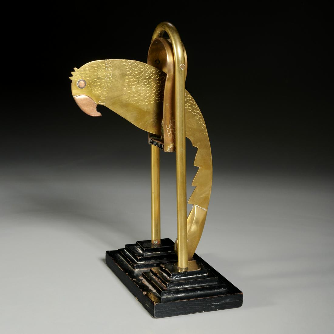 Art Deco mixed metal kinetic parrot sculpture: Art Deco mixed metal kinetic parrot sculpture, Mid-20th c., poss. Mexican, parrot sits and pivots on separate brass and black painted stepped wooden stand, no visible marks, approx. 12.5"h x 7"w x 7"d