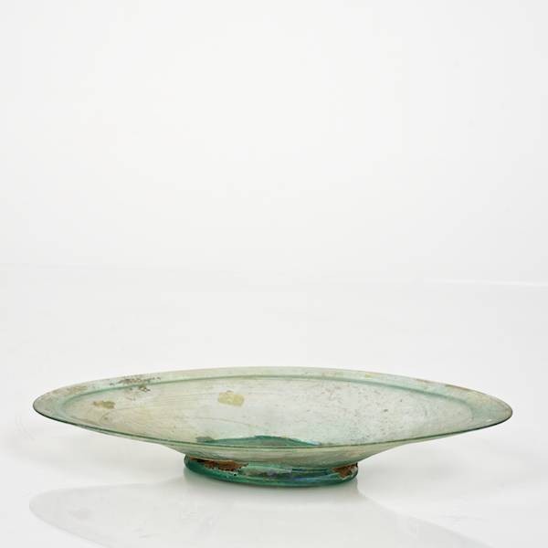 Roman green glass dish of almond form on low foot