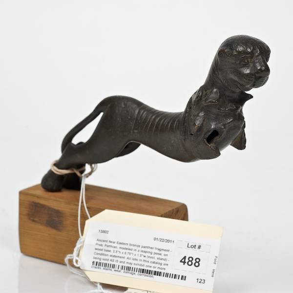 Ancient Near Eastern bronze panther fragment: Ancient Near Eastern bronze panther fragment, Prob. Parthian, modeled in a leaping pose, on wood base, 3.5"h x 6.75"l x 1.5"w (excl. stand) Provenance: From an important and internationally renowned 