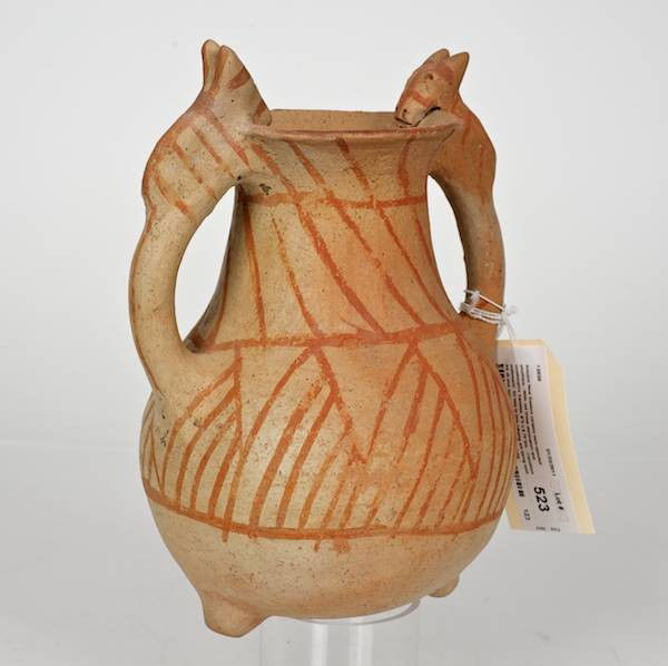 Ancient Near Eastern ceramic twin-spouted amphora: Ancient Near Eastern ceramic twin-spouted amphora, With red linear decoration and zoomorphic handles, 9"h x 6.75"dia. Provenance: From an important and internationally renowned single owner collecti