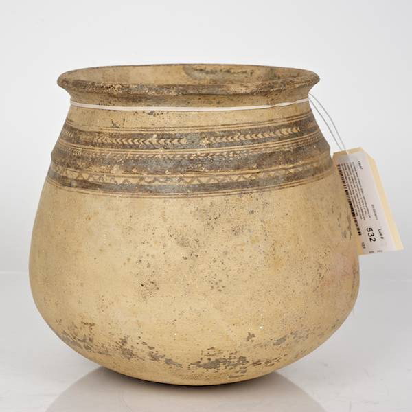 Ancient Near Eastern black painted pottery jar: Ancient Near Eastern black painted pottery jar, Chevron banding under rim, 8.75"h x 9"dia. Provenance: From an important and internationally renowned single owner collection sold anonymously without