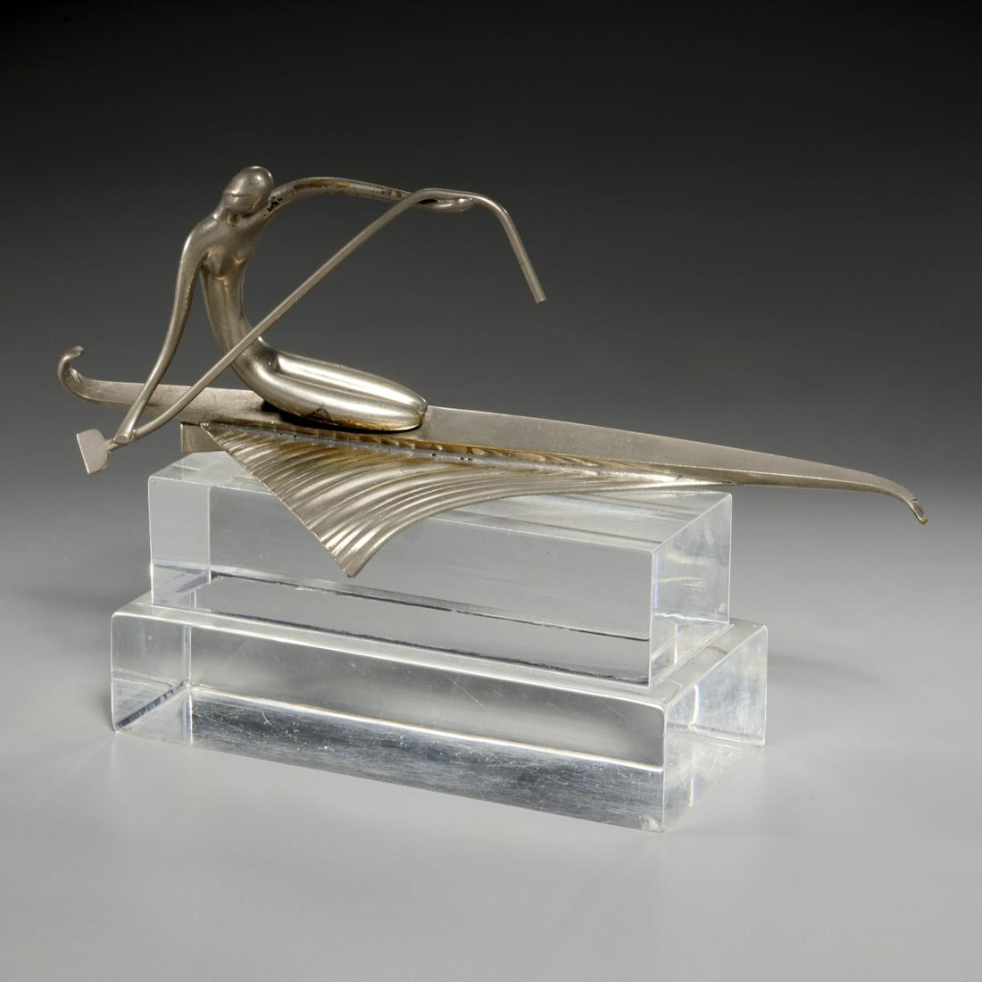 Karl Hagenauer, silvered bronze sculpture: Karl Hagenauer, silvered bronze sculpture, First half 20th c., Austria, Nude Woman Rowing Canoe, stamped to underside, sits on lucite base, 4"h x 10"l x 3"w (sculpture), 6.5"h (total) Provenance: Prop