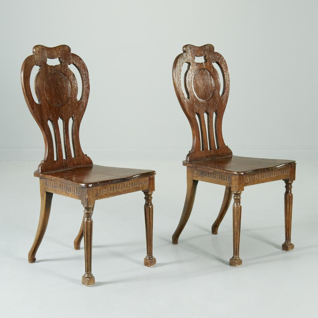 Pair George III carved mahogany hall chairs (1 of 7)
