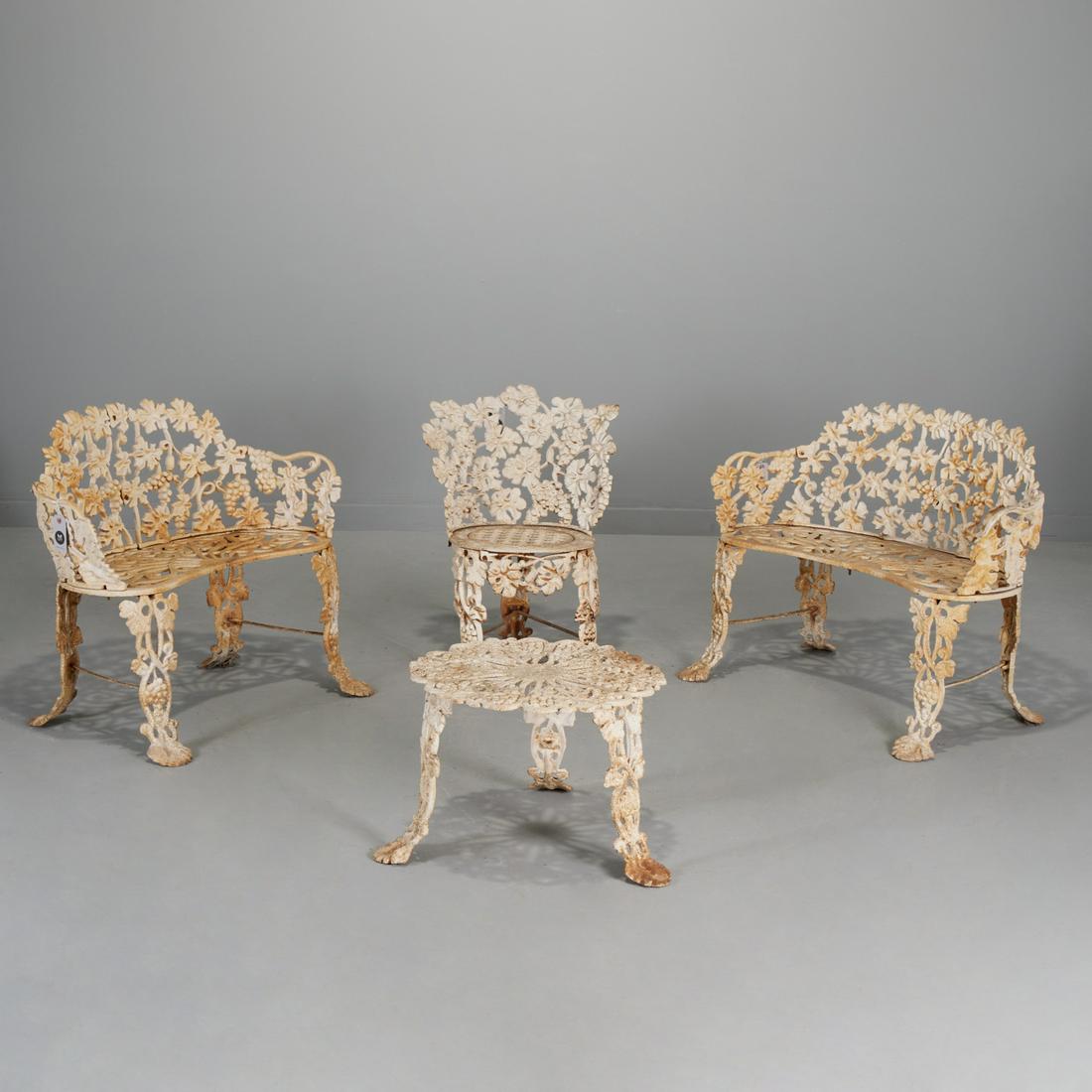 American cast iron garden seating group: American cast iron garden seating group, Late 19th c. or later, white painted cast iron, grapevine pattern, including (2) settees with kidney seat, (1) chair, and (1) drinks table, some marked with va