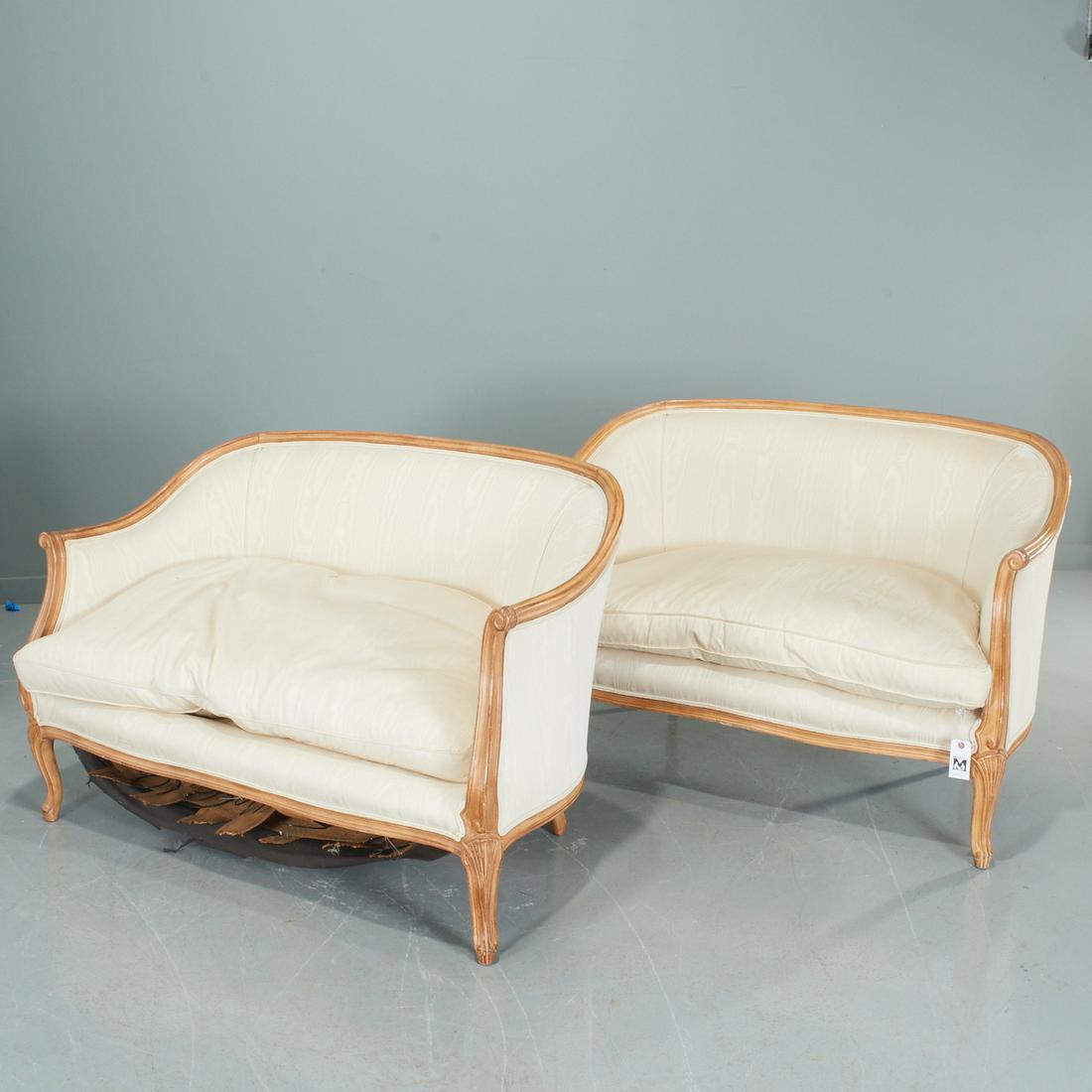 Pair Louis XV style upholstered settees: Pair Louis XV style upholstered settees, 20th c., each with down filled single seat cushion, 32.25"h x 50"w x 31"d