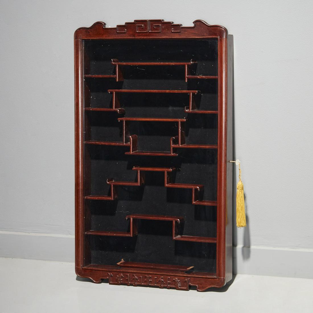 Chinese carved hardwood wall cabinet: Chinese carved hardwood wall cabinet, 20th c., with single glass door, unmarked, 33"h x 20"w x 3"d