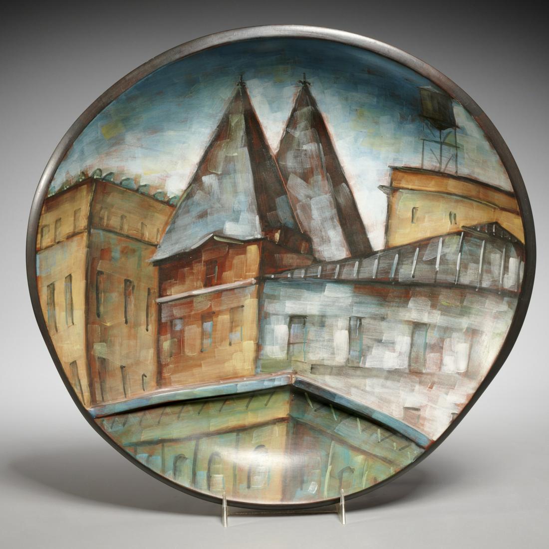 Lydia Buzio, painted terracotta charger, 1987: Lydia Buzio, painted terracotta charger, 1987, Lydia Buzio (American,1948-2014), decorated with a cubist cityscape, incised signature and date verso, numbered XV/87, 13"dia Provenance: Garth Clark Gal