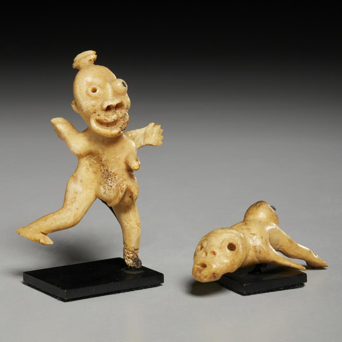 (2) Antique Inuit Tupilaq carvings: (2) Antique Inuit Tupilaq carvings, 19th/20th c., Greenland, Tupilak ritualistic fetish used by Shamans to curse or destroy enemies, carved bone, baleen eyes, one modeled with arms thrust backwards, s