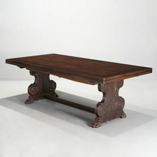 Schmieg & Kotzian, Renaissance Revival long table: Schmieg & Kotzian, Renaissance Revival long table, Early 20th c., American, the rectangular top over two extending leaves, raised on scroll-carved trestle base decorated with relief fleur de lis and r