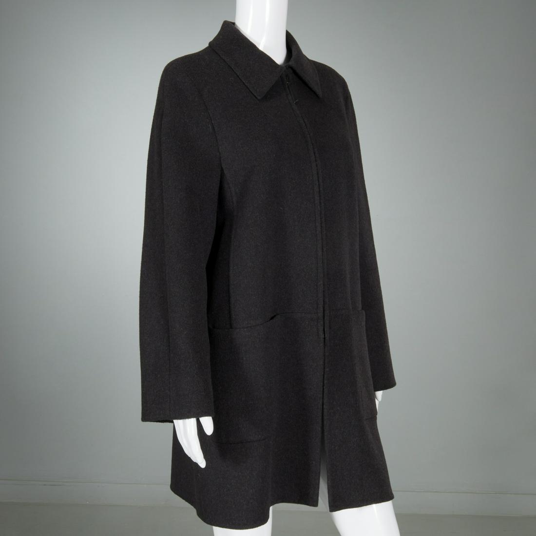 Ladies Akris cashmere coat: Ladies Akris cashmere coat, 21st c. Made in Italy for Bergdorf Goodman, charcoal gray with light gray lining, silk lined sleeves, zip front closure with leather pull, patch pockets, size 10, approx. 3